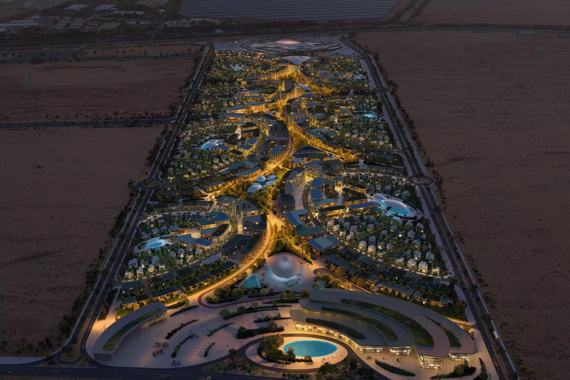 Dubai skyline towers lit up along the water at night