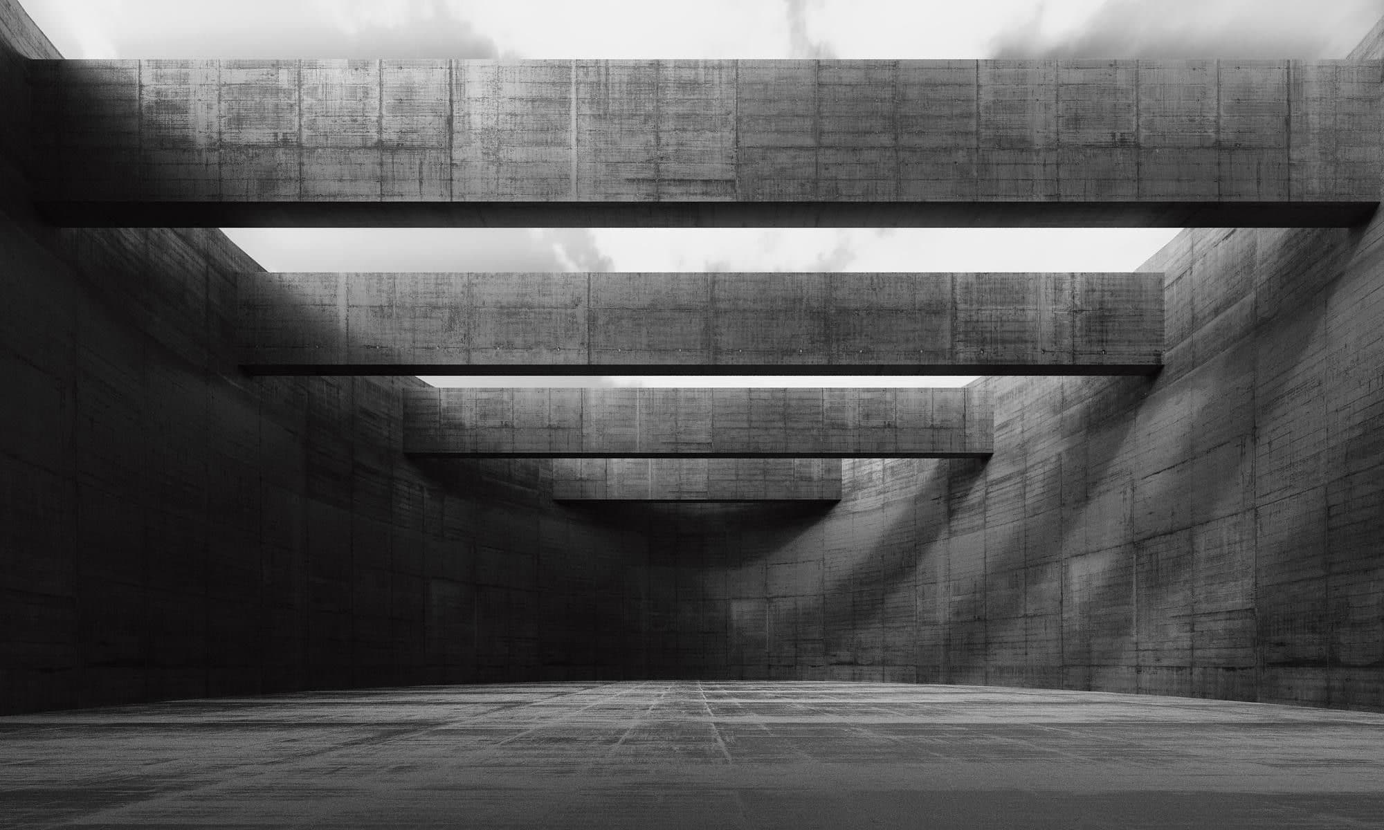 Monumental concrete entrance lit from within