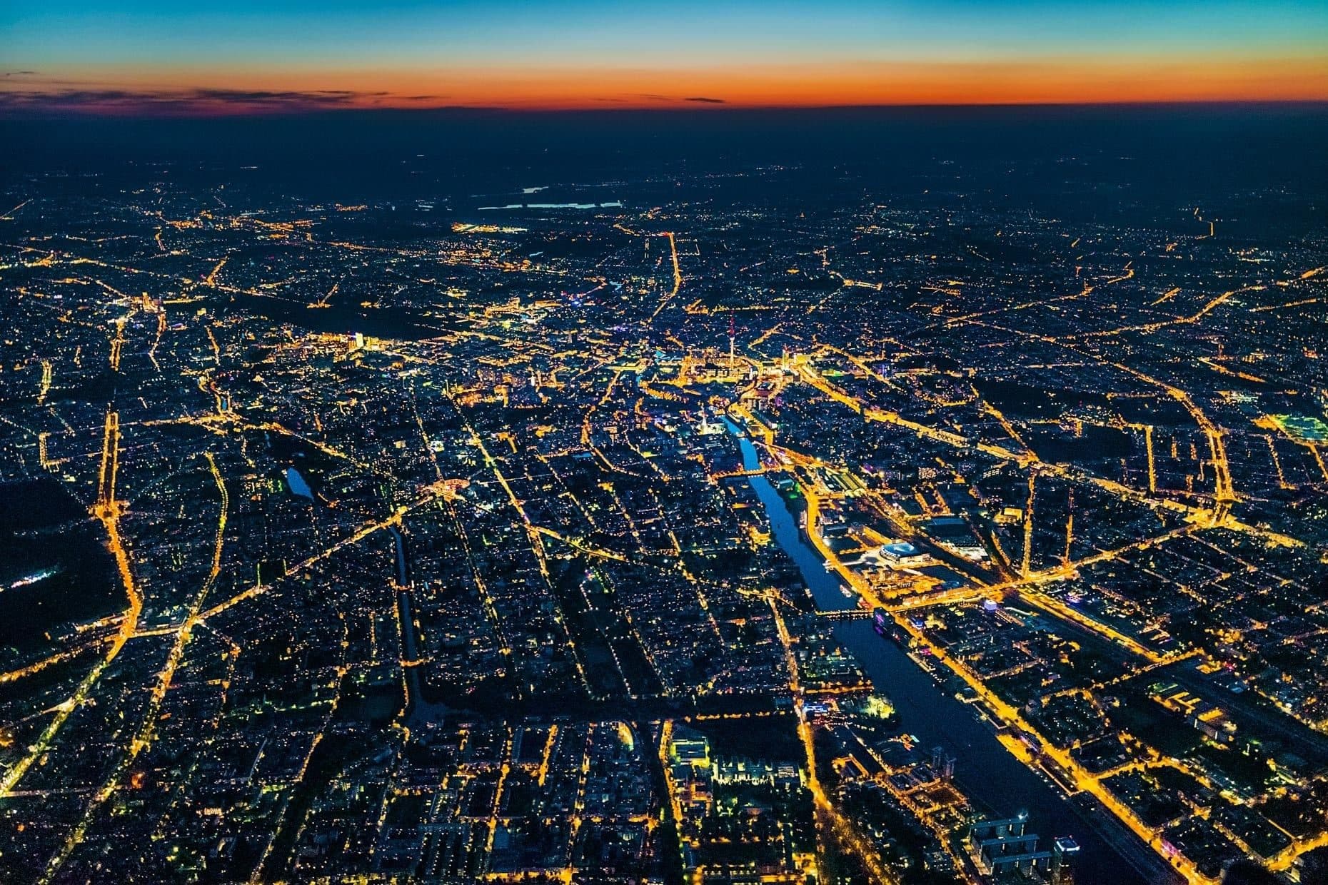 Aerial view of a city street grid lit up at night